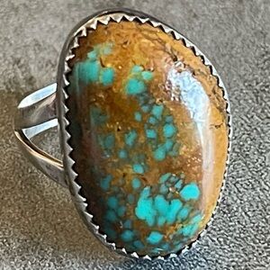 Turquoise set in a Sterling Silver Sawtooth Bezel